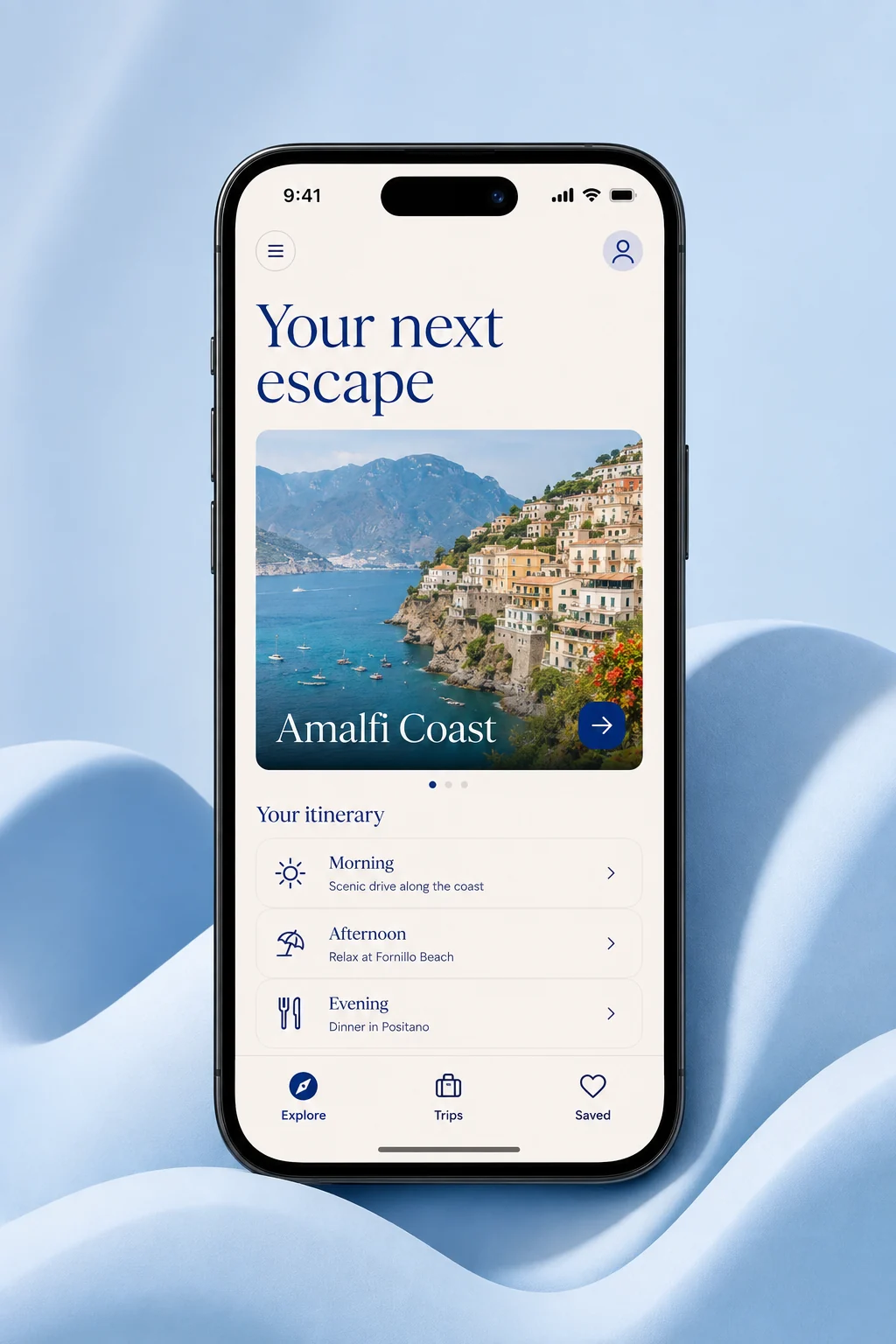 A travel app with a coastal destination and daily itinerary on a phone among sky-blue sculptural forms.